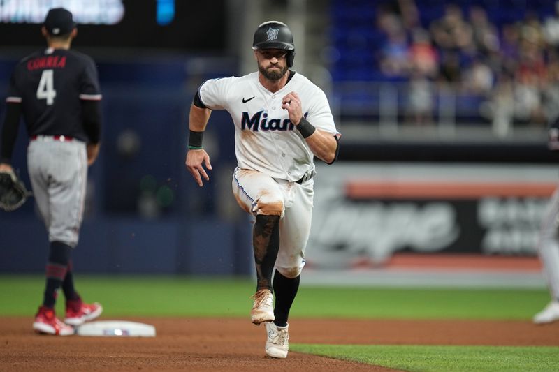 Apr 4, 2023; Miami, Florida, USA;  Miami Marlins third baseman Jon Berti (5) tags-up and advances to third base on a fly ball in the sixth inning against the Minnesota Twinsat loanDepot Park. Mandatory Credit: Jim Rassol-USA TODAY Sports