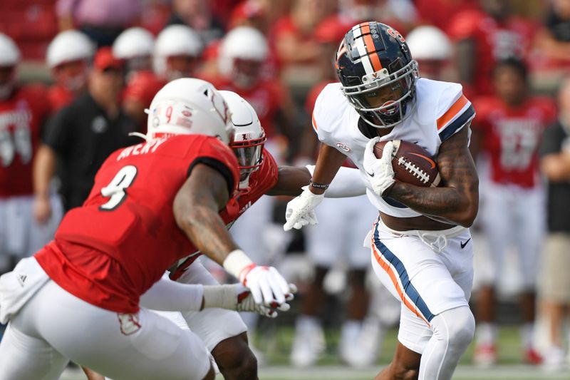 Oct 9, 2021; Louisville, Kentucky, USA;  Virginia Cavaliers wide receiver Dontayvion Wicks (3) runs the ball against Louisville Cardinals linebacker C.J. Avery (9) during the first quarter at Cardinal Stadium. Mandatory Credit: Jamie Rhodes-USA TODAY Sports
