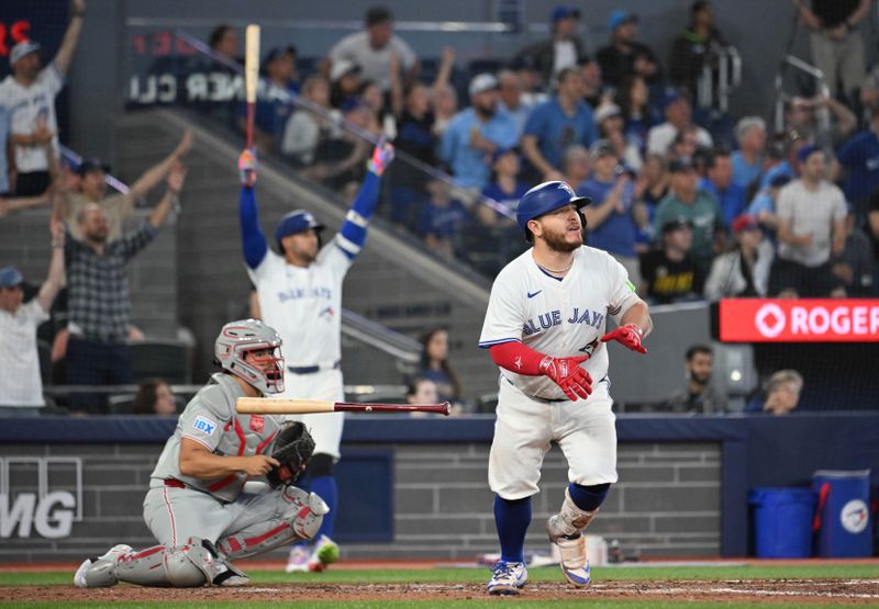 Jun 4, 2025; Toronto, Ontario, CAN;  Toronto Blue Jays catcher Alejandro Kirk (30) hits a walkoff RBI double against the Philadelphia Phillies in the ninth inning at Rogers Centre. Mandatory Credit: Dan Hamilton-Imagn Images