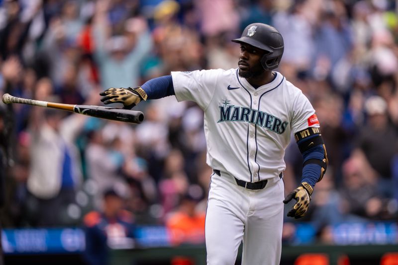 Apr 9, 2025; Seattle, Washington, USA;  Seattle Mariners left fielder Randy Arozarena (56) tosses his bat after hitting a grand slam home run during the eighth inning against the Houston Astros at T-Mobile Park. Mandatory Credit: Stephen Brashear-Imagn Images