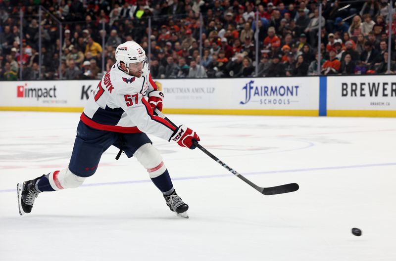 Mar 11, 2025; Anaheim, California, USA; Washington Capitals defenseman Trevor van Riemsdyk (57) shoots during the first period Anaheim Ducksa at Honda Center. Mandatory Credit: Jason Parkhurst-Imagn Images