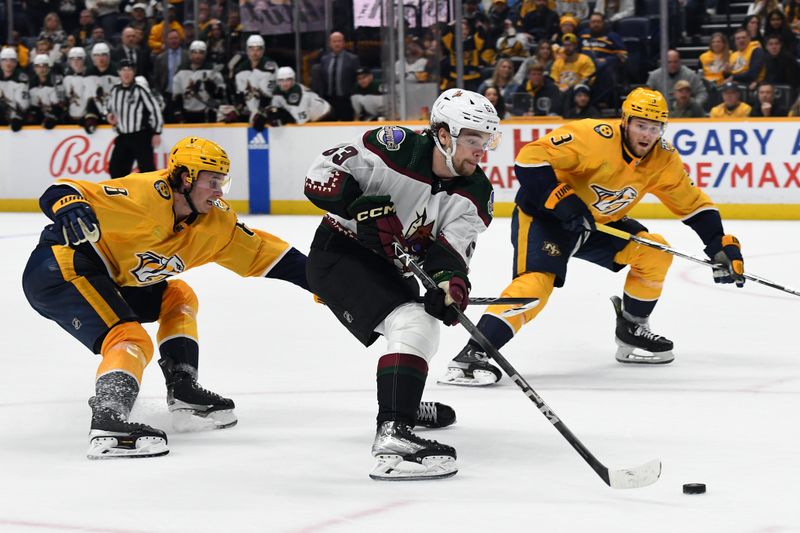 Feb 10, 2024; Nashville, Tennessee, USA; Arizona Coyotes left wing Matias Maccelli (63) skates with the puck in overtime against the Nashville Predators at Bridgestone Arena. Mandatory Credit: Christopher Hanewinckel-USA TODAY Sports