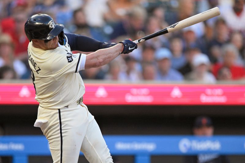 Jul 3, 2024; Minneapolis, Minnesota, USA; Minnesota Twins catcher Christian Vazquez (8) hits a solo home run against the Detroit Tigers during the fourth inning at Target Field. Mandatory Credit: Nick Wosika-USA TODAY Sports