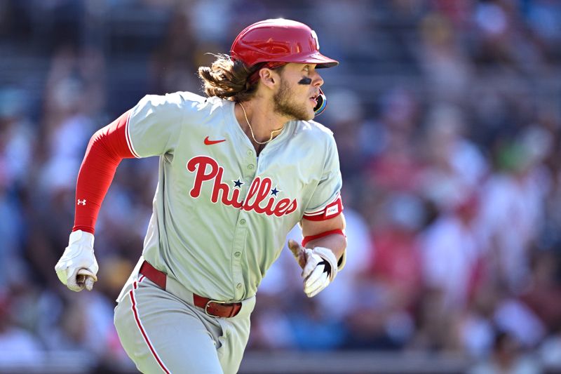 Apr 28, 2024; San Diego, California, USA; Philadelphia Phillies third baseman Alec Bohm (28) watches his double against the San Diego Padres during the ninth inning at Petco Park. Mandatory Credit: Orlando Ramirez-USA TODAY Sports