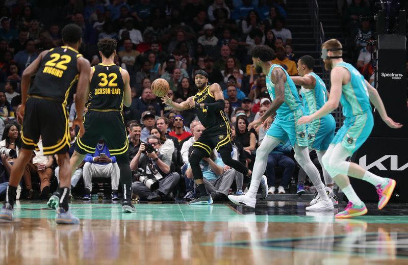 CHARLOTTE, NC - MARCH 29:  Moses Moody #4 of the Golden State Warriors passes the ball during the game against the Charlotte Hornets on March 29, 2024 at Spectrum Center in Charlotte, North Carolina. NOTE TO USER: User expressly acknowledges and agrees that, by downloading and or using this photograph, User is consenting to the terms and conditions of the Getty Images License Agreement.  Mandatory Copyright Notice:  Copyright 2024 NBAE (Photo by Brock Williams-Smith/NBAE via Getty Images)