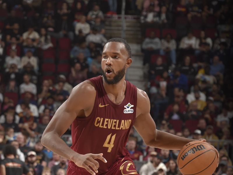 CLEVELAND, OH - NOVEMBER 4: Evan Mobley #4 of the Cleveland Cavaliers handles the ball during the game against the Milwaukee Bucks on November 4, 2024 at Rocket Mortgage FieldHouse in Cleveland, Ohio. NOTE TO USER: User expressly acknowledges and agrees that, by downloading and/or using this Photograph, user is consenting to the terms and conditions of the Getty Images License Agreement. Mandatory Copyright Notice: Copyright 2024 NBAE (Photo by David Liam Kyle/NBAE via Getty Images)