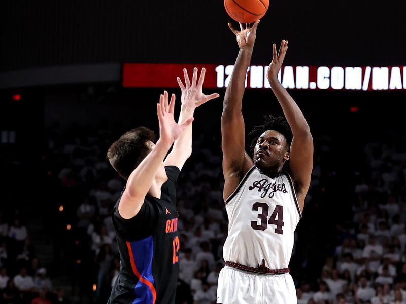 Jan 18, 2023; College Station, Texas, USA; Texas A&M Aggies forward Julius Marble (34) shoots the ball while Florida Gators forward Colin Castleton (12) defends during the second half at Reed Arena. Mandatory Credit: Erik Williams-USA TODAY Sports
