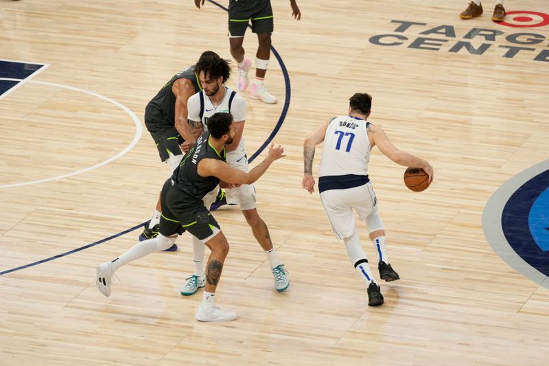 MINNEAPOLIS, MN - MAY 30: Luka Doncic #77 of the Dallas Mavericks dribbles the ball during the game against the Minnesota Timberwolves during Game 5 of the Western Conference Finals of the 2024 NBA Playoffs on May 30, 2024 at Target Center in Minneapolis, Minnesota. NOTE TO USER: User expressly acknowledges and agrees that, by downloading and or using this Photograph, user is consenting to the terms and conditions of the Getty Images License Agreement. Mandatory Copyright Notice: Copyright 2024 NBAE (Photo by Jordan Johnson/NBAE via Getty Images)