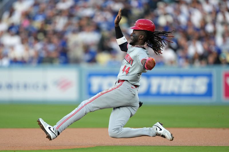 May 16, 2024; Los Angeles, California, USA; Cincinnati Reds shortstop Elly De La Cruz (44) slides into second base on a stolen base in the first inning against the Los Angeles Dodgers at Dodger Stadium. Mandatory Credit: Kirby Lee-USA TODAY Sports