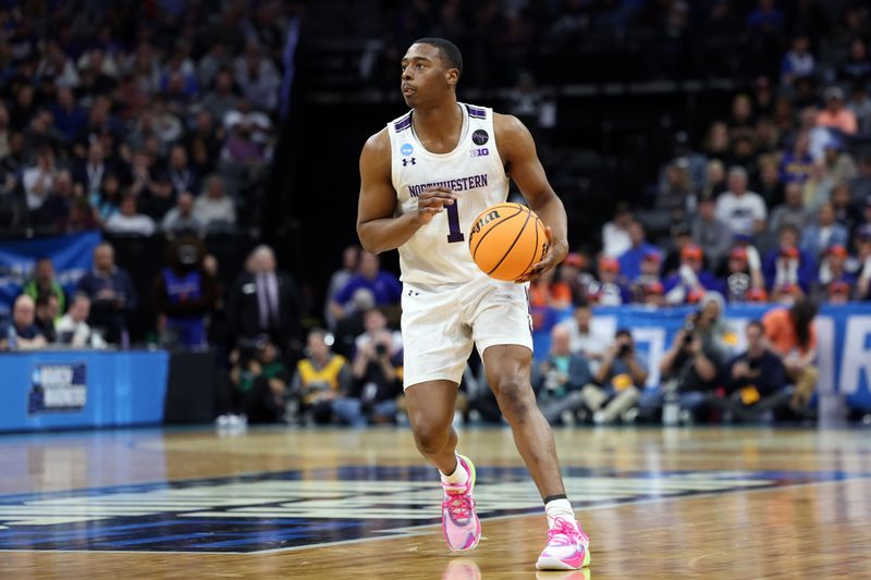 Mar 16, 2023; Sacramento, CA, USA; Northwestern Wildcats guard Chase Audige (1) controls the ball in the second half against the Boise State Broncos at Golden 1 Center. Mandatory Credit: Kelley L Cox-USA TODAY Sports