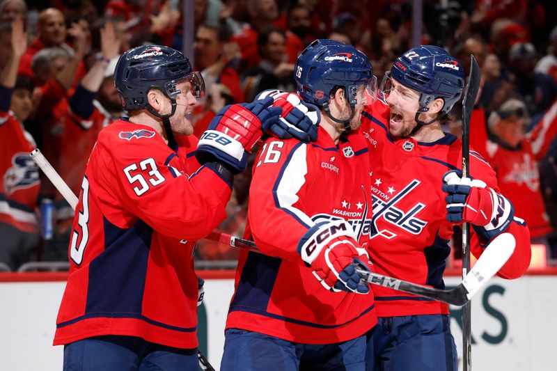 Oct 21, 2025; Washington, District of Columbia, USA; Washington Capitals center Nic Dowd (26) celebrates with teammates after scoring a goal against the Seattle Kraken during the first period at Capital One Arena. Mandatory Credit: Geoff Burke-Imagn Images