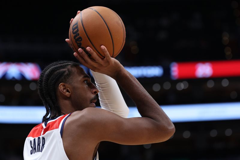 WASHINGTON, DC - OCTOBER 11: Alex Sarr #20 of the Washington Wizards shoots the ball against the Toronto Raptors during the first half of a preseason game at Capital One Arena on October 11, 2024 in Washington, DC. NOTE TO USER: User expressly acknowledges and agrees that, by downloading and or using this photograph, User is consenting to the terms and conditions of the Getty Images License Agreement. (Photo by Patrick Smith/Getty Images)