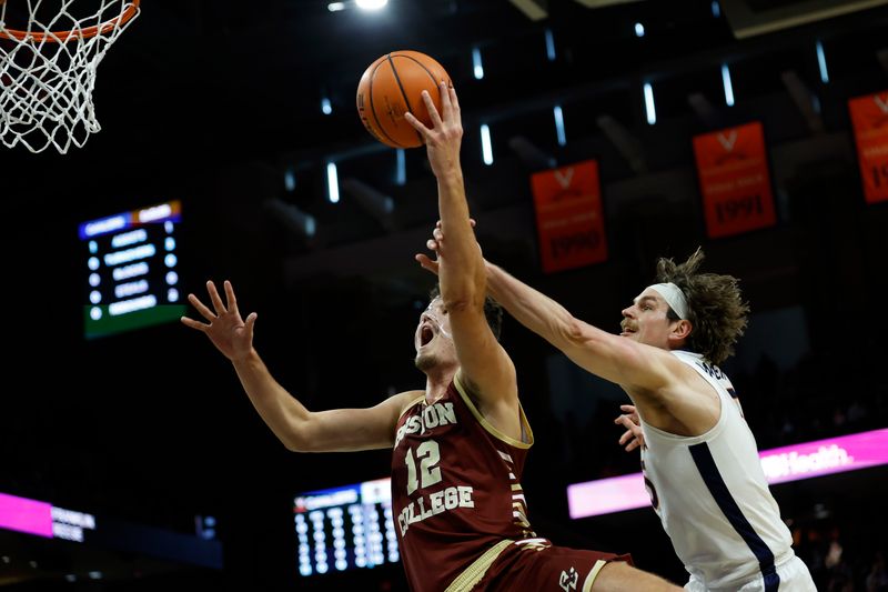 Jan 28, 2023; Charlottesville, Virginia, USA; Boston College Eagles forward Quinten Post (12) shoots the ball as Virginia Cavaliers forward Ben Vander Plas (5) defends in the first half at John Paul Jones Arena. Mandatory Credit: Geoff Burke-USA TODAY Sports