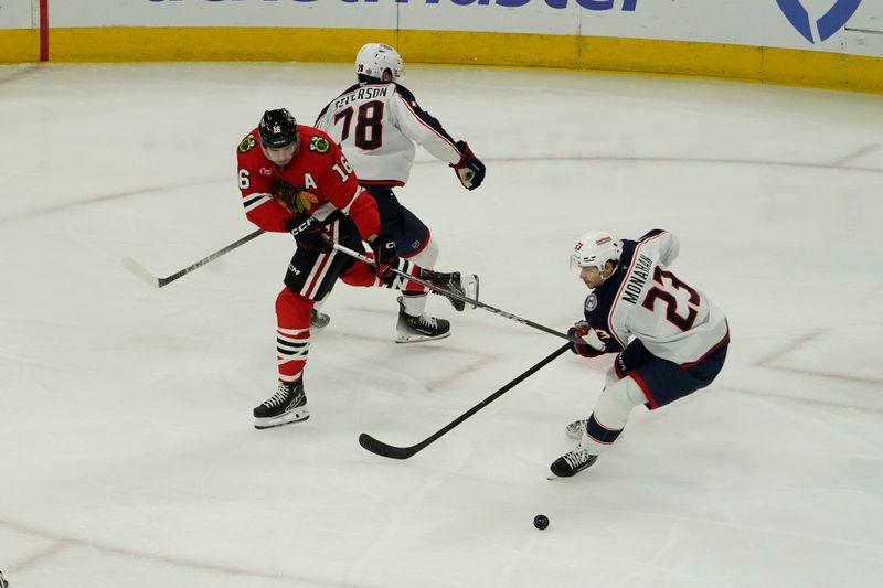 Dec 1, 2024; Chicago, Illinois, USA; Chicago Blackhawks center Jason Dickinson (16) and Columbus Blue Jackets center Sean Monahan (23) go for the the puck during the third period at United Center. Mandatory Credit: David Banks-Imagn Images