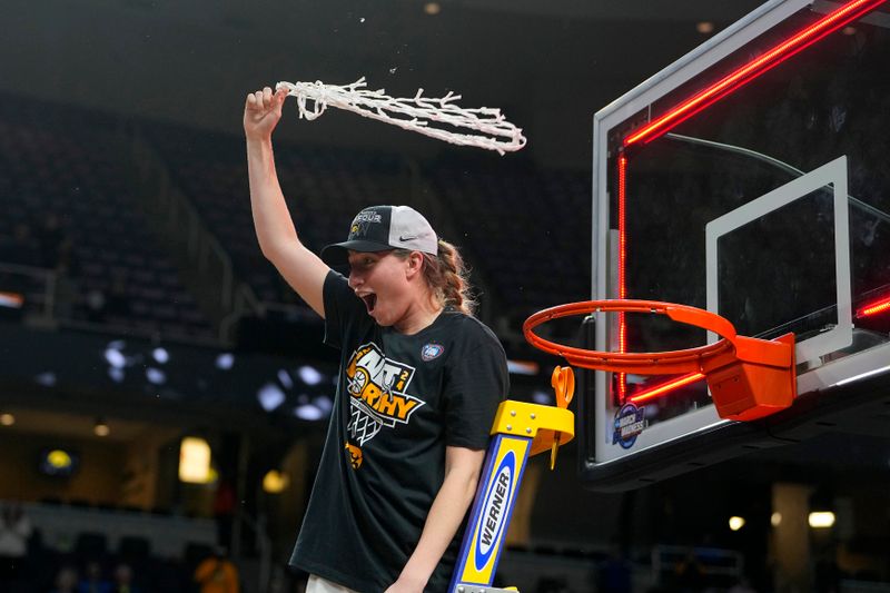 Apr 1, 2024; Albany, NY, USA; Iowa Hawkeyes guard Kate Martin (20) cuts the net after defeating the LSU Lady Tigers in the finals of the Albany Regional in the 2024 NCAA Tournament at MVP Arena. Mandatory Credit: Gregory Fisher-USA TODAY Sports