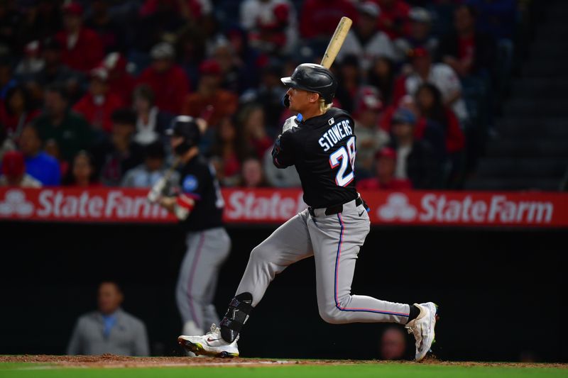 May 24, 2025; Anaheim, California, USA; Miami Marlins center fielder Kyle Stowers (28) hits into a double play and brings in a run against the Los Angeles Angels during the fifth inning at Angel Stadium. Mandatory Credit: Gary A. Vasquez-Imagn Images