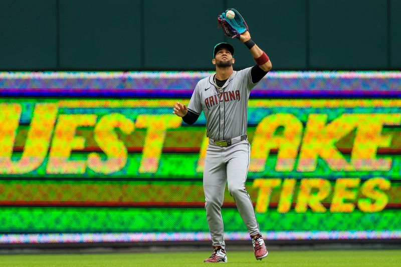 May 9, 2024; Cincinnati, Ohio, USA; Arizona Diamondbacks outfielder Lourdes Gurriel Jr. (12) catches a pop up hit by Cincinnati Reds outfielder TJ Friedl (not pictured) in the fifth inning at Great American Ball Park. Mandatory Credit: Katie Stratman-USA TODAY Sports