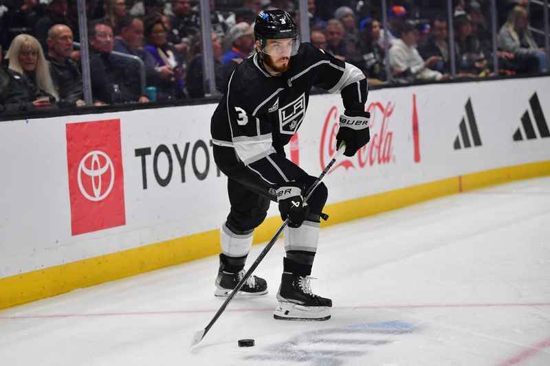 Mar 11, 2024; Los Angeles, California, USA; Los Angeles Kings defenseman Matt Roy (3) controls the puck against the New York Islanders during the first period at Crypto.com Arena. Mandatory Credit: Gary A. Vasquez-USA TODAY Sports