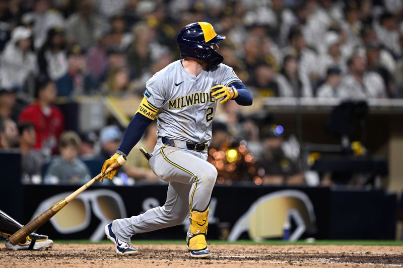 Jun 20, 2024; San Diego, California, USA; Milwaukee Brewers second baseman Brice Turang (2) hits an RBI single against the San Diego Padres during the eighth inning at Petco Park. Mandatory Credit: Orlando Ramirez-USA TODAY Sports