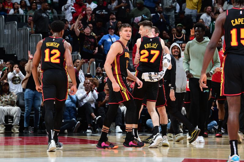 ATLANTA, GA - MARCH 28: Bogdan Bogdanovic #13 of the Atlanta Hawks celebrates after hitting the game tying shot during the game against the Boston Celtics on March 28, 2024 at State Farm Arena in Atlanta, Georgia.  NOTE TO USER: User expressly acknowledges and agrees that, by downloading and/or using this Photograph, user is consenting to the terms and conditions of the Getty Images License Agreement. Mandatory Copyright Notice: Copyright 2024 NBAE (Photo by Scott Cunningham/NBAE via Getty Images)