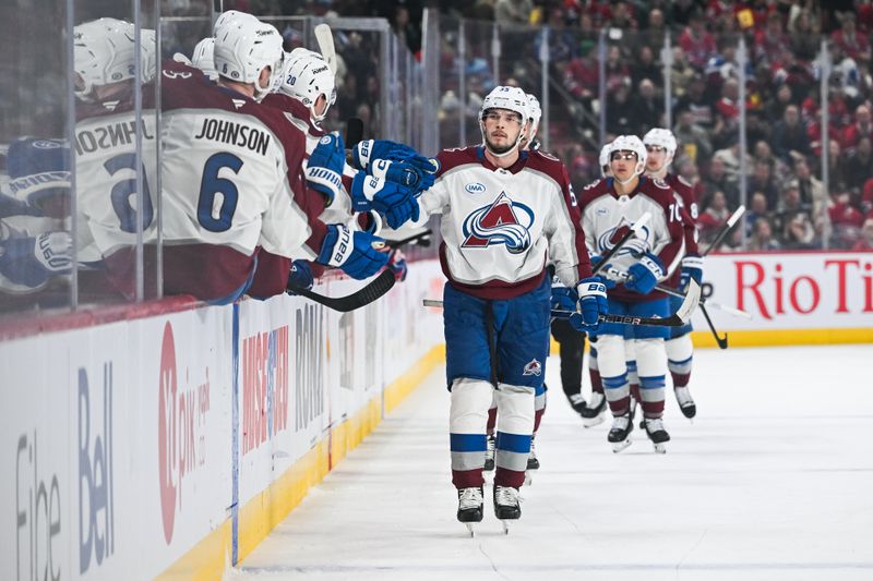 Mar 22, 2025; Montreal, Quebec, CAN; Colorado Avalanche defenseman Ryan Lindgren (55) celebrates his goal with teammates against the Montreal Canadiens in the first period at Bell Centre. Mandatory Credit: David Kirouac-Imagn Images