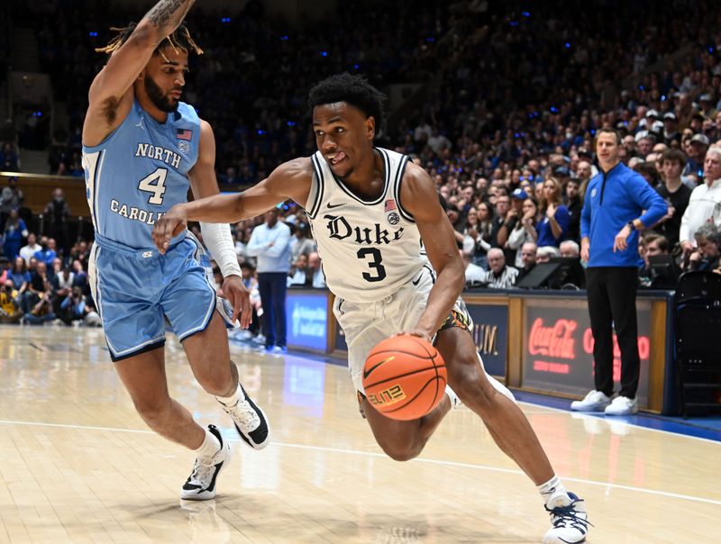 Feb 4, 2023; Durham, North Carolina, USA; Duke Blue Devils guard Jeremy Roach (3) drives to the basket as North Carolina Tar Heels guard RJ Davis (4) defends during the second half at Cameron Indoor Stadium.  The Blue Devils won 63-57. Mandatory Credit: Rob Kinnan-USA TODAY Sports