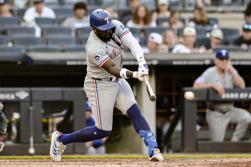 Aug 10, 2024; Bronx, New York, USA; Texas Rangers outfielder Adolis García (53) hits a single against the New York Yankees during the seventh inning at Yankee Stadium. Mandatory Credit: John Jones-USA TODAY Sports