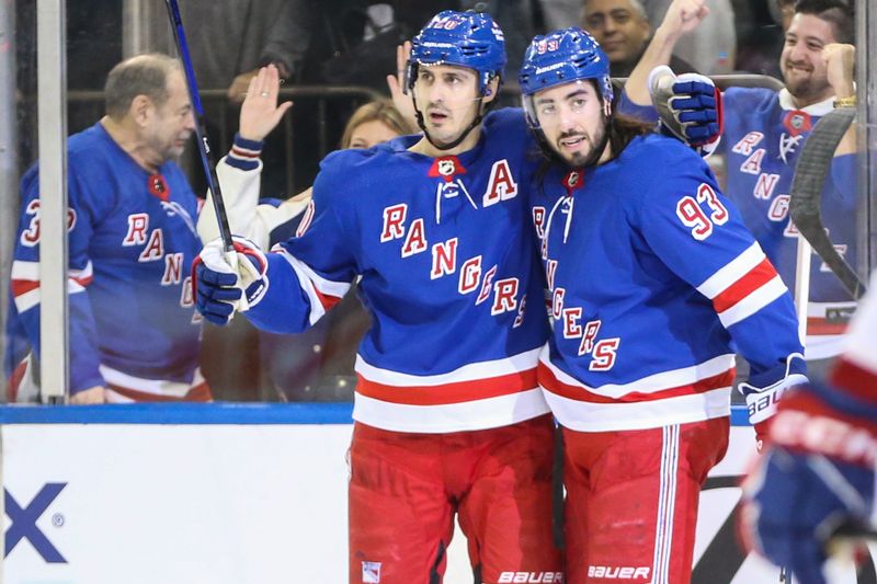 Feb 15, 2024; New York, New York, USA; New York Rangers left wing Chris Kreider (20) celebrates with center Mika Zibanejad (93) after scoring a goal in the second period against the Montreal Canadiens at Madison Square Garden. Mandatory Credit: Wendell Cruz-USA TODAY Sports