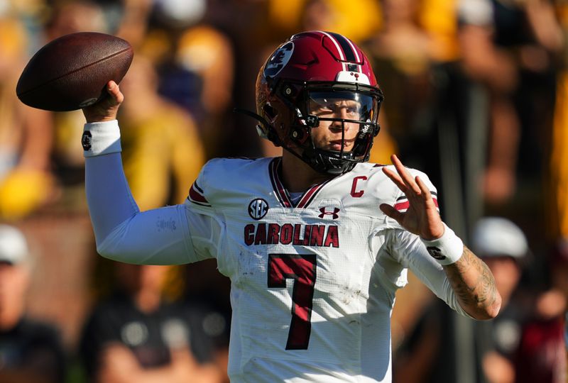 Oct 21, 2023; Columbia, Missouri, USA; South Carolina Gamecocks quarterback Spencer Rattler (7) throws a pass against the Missouri Tigers during the first half at Faurot Field at Memorial Stadium. Mandatory Credit: Jay Biggerstaff-USA TODAY Sports