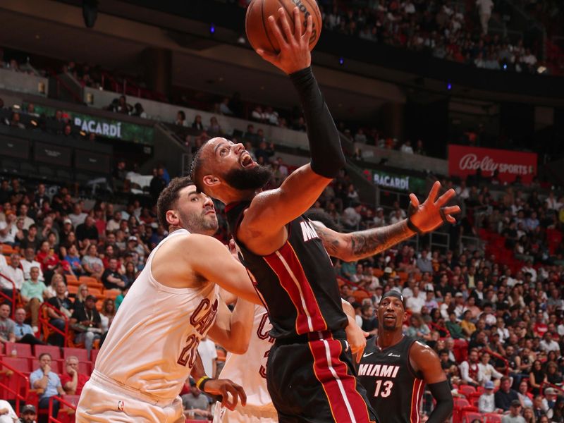 MIAMI, FL - MARCH 24: Caleb Martin #16 of the Miami Heat drives to the basket during the game against the Cleveland Cavaliers on March 24, 2024 at Kaseya Center in Miami, Florida. NOTE TO USER: User expressly acknowledges and agrees that, by downloading and or using this Photograph, user is consenting to the terms and conditions of the Getty Images License Agreement. Mandatory Copyright Notice: Copyright 2024 NBAE (Photo by Issac Baldizon/NBAE via Getty Images)