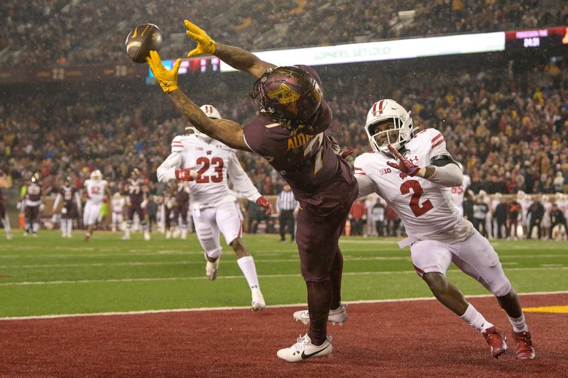 Nov 25, 2023; Minneapolis, Minnesota, USA; Minnesota Golden Gophers wide receiver Chris Autman-Bell (7) can   t haul in this pass as Wisconsin Badgers defensive back Ricardo Hallman (2) defends during the fourth quarter at Huntington Bank Stadium. Mandatory Credit: Nick Wosika-USA TODAY Sports