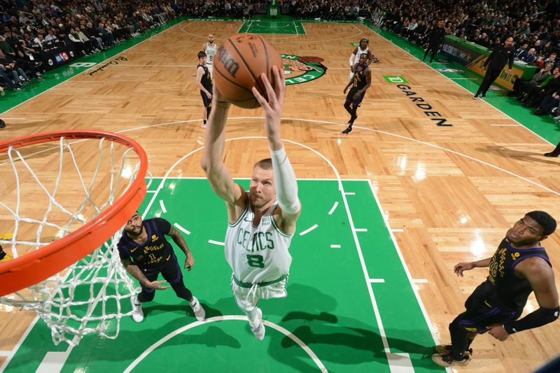 BOSTON, MA - FEBRUARY 1:  Kristaps Porzingis #8 of the Boston Celtics dunks the ball during the game against the Los Angeles Lakers on February 1, 2024 at the TD Garden in Boston, Massachusetts. NOTE TO USER: User expressly acknowledges and agrees that, by downloading and or using this photograph, User is consenting to the terms and conditions of the Getty Images License Agreement. Mandatory Copyright Notice: Copyright 2024 NBAE  (Photo by Brian Babineau/NBAE via Getty Images)