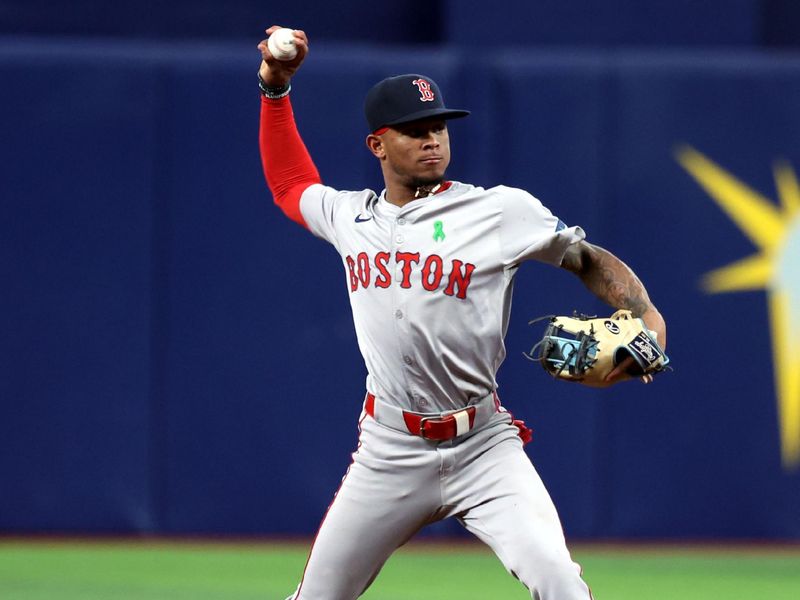 May 20, 2024; St. Petersburg, Florida, USA;  Boston Red Sox shortstop Ceddanne Rafaela (43) throws the ball to first base for an out against the Tampa Bay Rays during the third inning at Tropicana Field. Mandatory Credit: Kim Klement Neitzel-USA TODAY Sports