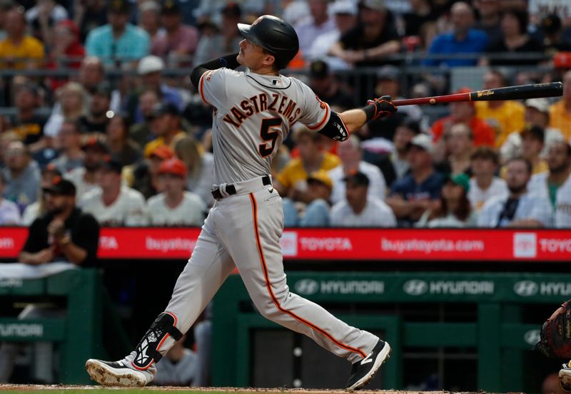 Jul 15, 2023; Pittsburgh, Pennsylvania, USA;  San Francisco Giants center fielder Mike Yastrzemski (5) hits a solo home run against the Pittsburgh Pirates during the second inning at PNC Park. Mandatory Credit: Charles LeClaire-USA TODAY Sports