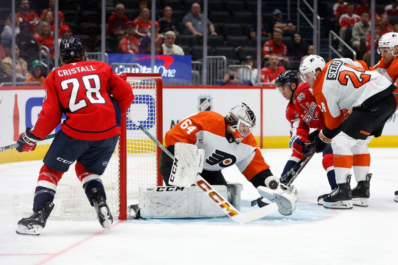 Sep 22, 2024; Washington, District of Columbia, USA; Philadelphia Flyers goaltender Carson Bjarnason (64) makes a save on Washington Capitals forward Henrik Rybinski (58) in the third period at Capital One Arena. Mandatory Credit: Geoff Burke-Imagn Images