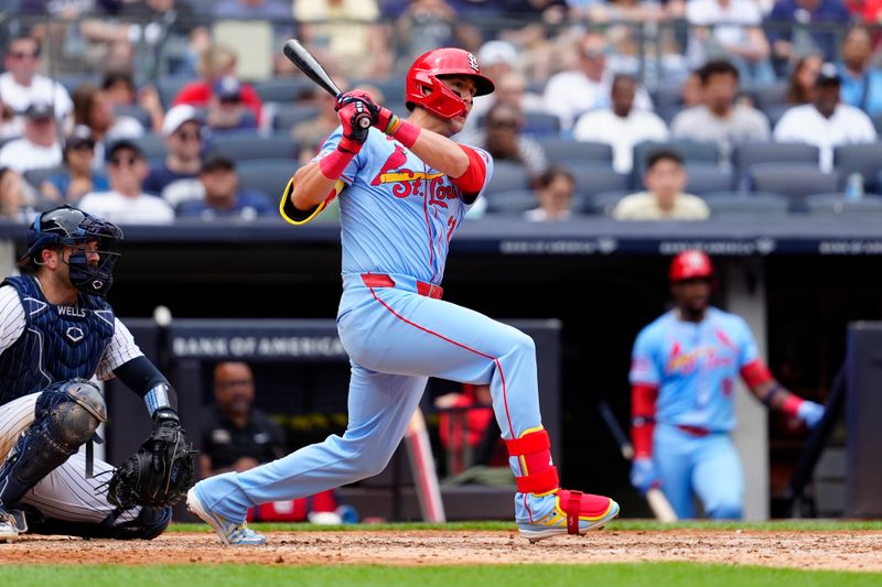 Aug 31, 2024; Bronx, New York, USA; St. Louis Cardinals left fielder Lars Nootbaar (21) hits a double against the New York Yankees during the sixth inning at Yankee Stadium. Mandatory Credit: Gregory Fisher-USA TODAY Sports