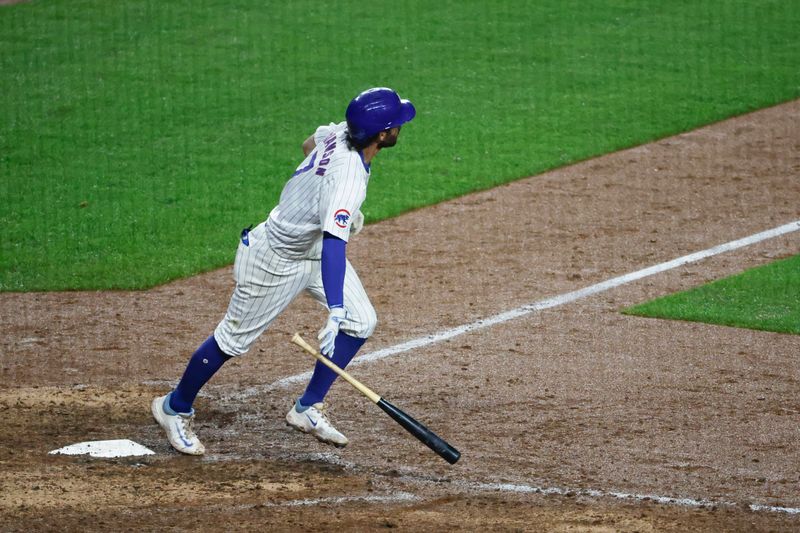 Jun 2, 2024; Chicago, Illinois, USA; Chicago Cubs shortstop Dansby Swanson (7) watches his two-run home run against the Cincinnati Reds during the eight inning at Wrigley Field. Mandatory Credit: Kamil Krzaczynski-USA TODAY Sports