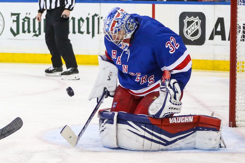 Feb 15, 2024; New York, New York, USA; New York Rangers goaltender Jonathan Quick (32) makes a save on a shot on goal attempt in the first period against the Montreal Canadiens at Madison Square Garden. Mandatory Credit: Wendell Cruz-USA TODAY Sports