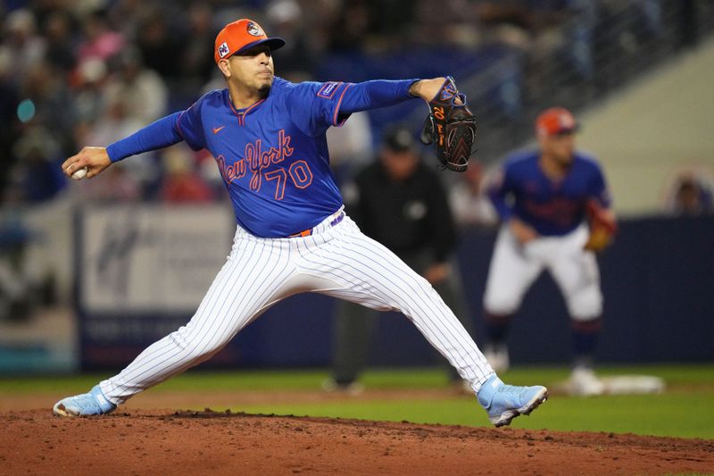 Mar 3, 2025; Port St. Lucie, Florida, USA;  New York Mets pitcher José Buttó (70) pitches in the sixth inning against the Miami Marlins at Clover Park. Mandatory Credit: Jim Rassol-Imagn Images