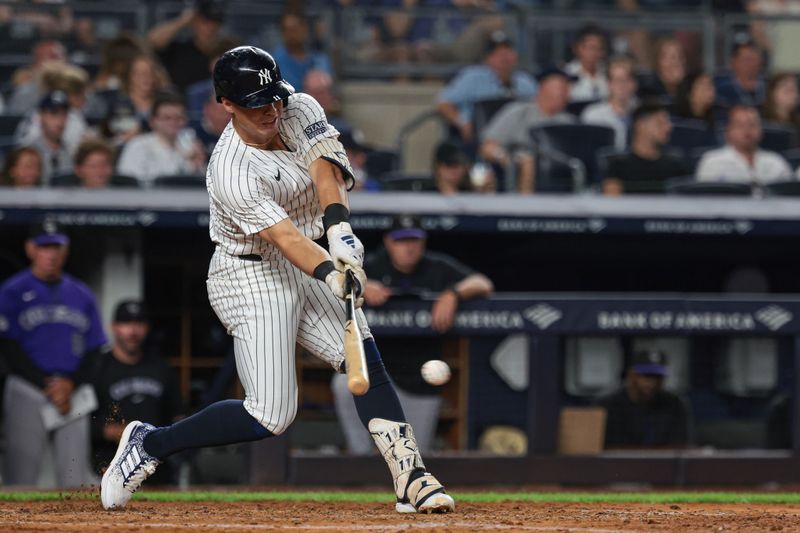 Aug 23, 2024; Bronx, New York, USA; New York Yankees shortstop Anthony Volpe (11) singles during the fifth inning against the Colorado Rockies at Yankee Stadium. Mandatory Credit: Vincent Carchietta-USA TODAY Sports