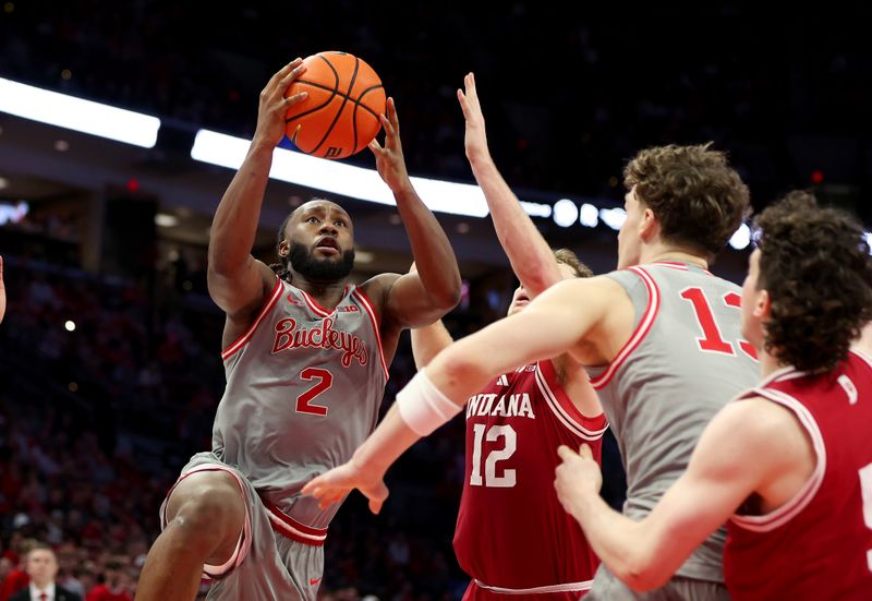 Mar 7, 2026; Columbus, Ohio, USA; Ohio State Buckeyes guard Bruce Thornton (2) drives to the basket as Indiana Hoosiers guard Lamar Wilkerson (3) defends during the second half at Value City Arena. Mandatory Credit: Joseph Maiorana-Imagn Images