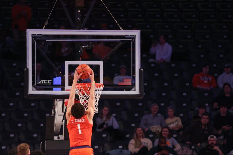 Jan 14, 2025; Atlanta, Georgia, USA; Clemson Tigers guard Chase Hunter (1) dunks the ball against the Georgia Tech Yellow Jackets during the first half at McCamish Pavilion. Mandatory Credit: Jordan Godfree-Imagn Images