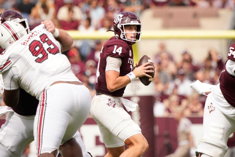 Oct 28, 2023; College Station, Texas, USA; Texas A&M Aggies quarterback Max Johnson (14) looks to pass during the second quarter in a game against South Carolina Gamecocks at Kyle Field. Mandatory Credit: Dustin Safranek-USA TODAY Sports