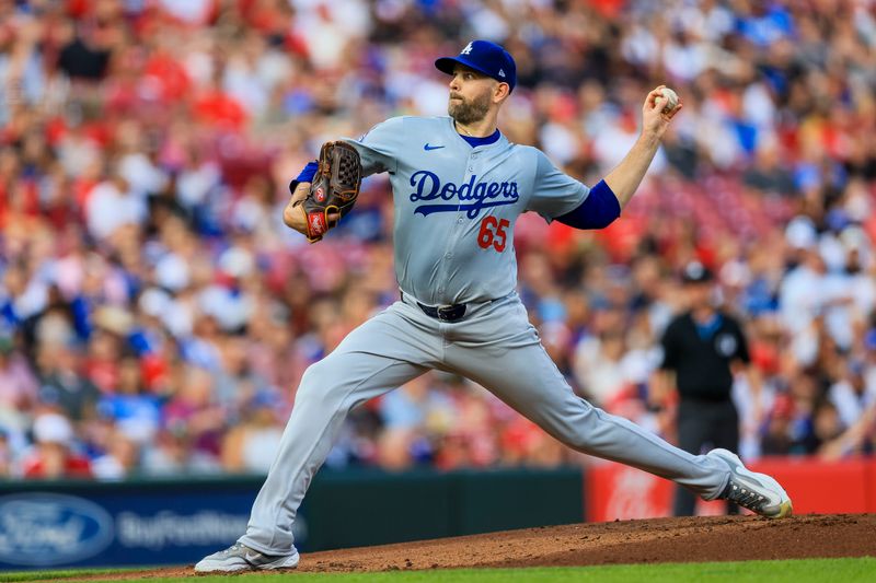 May 24, 2024; Cincinnati, Ohio, USA; Los Angeles Dodgers starting pitcher James Paxton (65) pitches against the Cincinnati Reds in the first inning at Great American Ball Park. Mandatory Credit: Katie Stratman-USA TODAY Sports