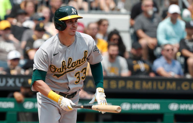 Jun 7, 2023; Pittsburgh, Pennsylvania, USA;  Oakland Athletics center fielder JJ Bleday (33) hits a single against the Pittsburgh Pirates during the sixth inning at PNC Park. Mandatory Credit: Charles LeClaire-USA TODAY Sports