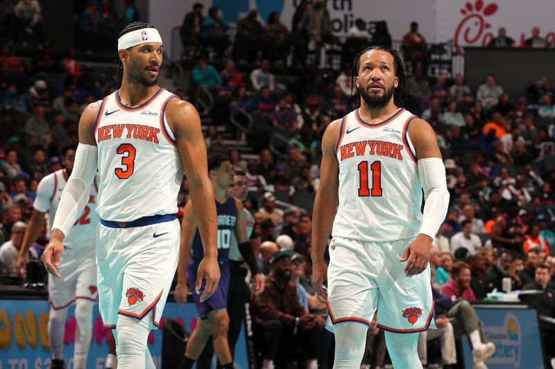 CHARLOTTE, NC - NOVEMBER 29: Josh Hart #3 and Jalen Brunson #11 of the New York Knicks look on during the game against the Charlotte Hornets during the Emirates NBA Cup game on November 29, 2024 at Spectrum Center in Charlotte, North Carolina. NOTE TO USER: User expressly acknowledges and agrees that, by downloading and or using this photograph, User is consenting to the terms and conditions of the Getty Images License Agreement. Mandatory Copyright Notice: Copyright 2024 NBAE (Photo by Kent Smith/NBAE via Getty Images)