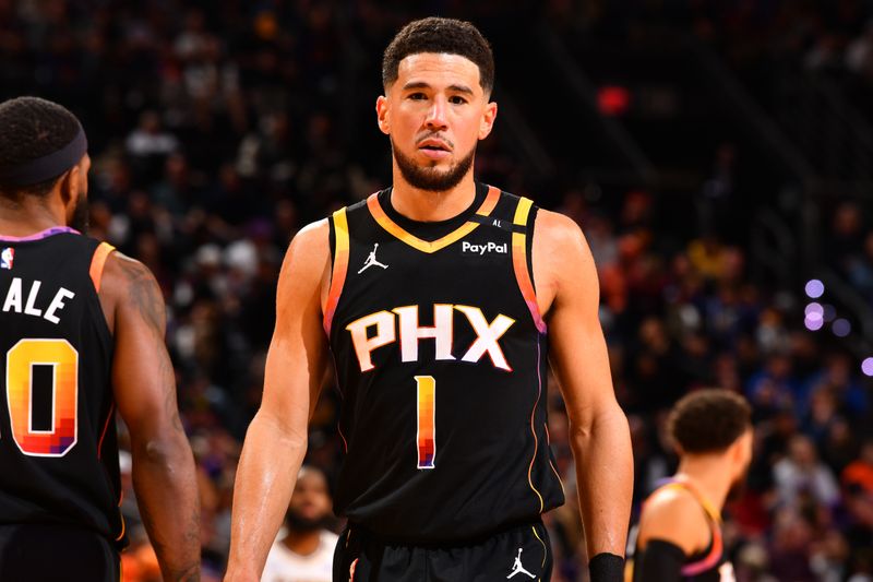 PHOENIX, AZ - NOVEMBER 26: Devin Booker #1 of the Phoenix Suns looks on during the game against the Los Angeles Lakers during the Emirates NBA Cup game on November 26, 2024 at Footprint Center in Phoenix, Arizona. NOTE TO USER: User expressly acknowledges and agrees that, by downloading and or using this photograph, user is consenting to the terms and conditions of the Getty Images License Agreement. Mandatory Copyright Notice: Copyright 2024 NBAE (Photo by Barry Gossage/NBAE via Getty Images)