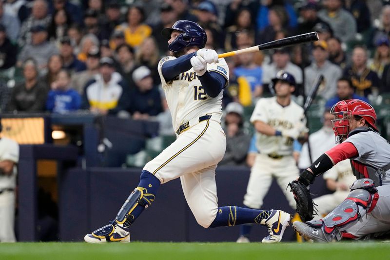 May 9, 2024; Milwaukee, Wisconsin, USA;  Milwaukee Brewers first baseman Rhys Hoskins (12) hits a home run during the first inning against the St. Louis Cardinals at American Family Field. Mandatory Credit: Jeff Hanisch-USA TODAY Sports