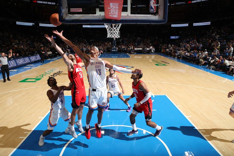 OKLAHOMA CITY, OK - OCTOBER 9: Ousmane Dieng #13 of the Oklahoma City Thunder goes up for the rebound during the game against the Houston Rockets during a NBA pre season game on October 9, 2024 at Paycom Center in Oklahoma City, Oklahoma. NOTE TO USER: User expressly acknowledges and agrees that, by downloading and or using this photograph, User is consenting to the terms and conditions of the Getty Images License Agreement. Mandatory Copyright Notice: Copyright 2024 NBAE (Photo by Zach Beeker/NBAE via Getty Images)