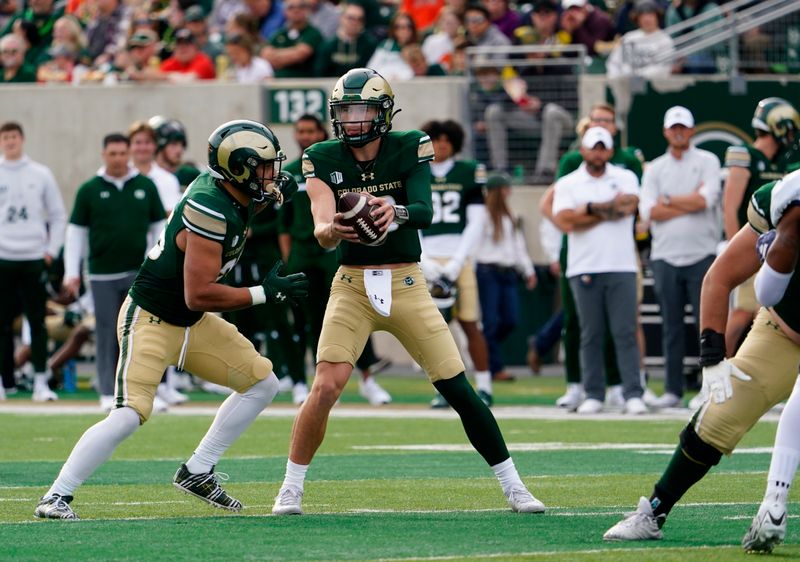 Nov 18, 2023; Fort Collins, Colorado, USA;  Colorado State Rams quarterback Brayden Fowler-Nicolosi (16) hands off to Colorado State Rams running back Avery Morrow (25) at Sonny Lubick Field at Canvas Stadium. Mandatory Credit: Michael Madrid-USA TODAY Sports